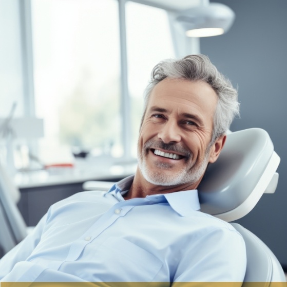 Man smiling in dental chair